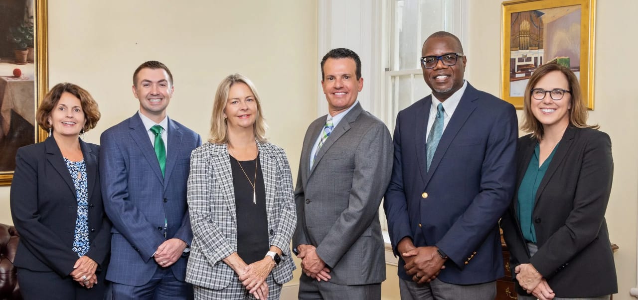 Members of the WPU senior leadership team stand in a row